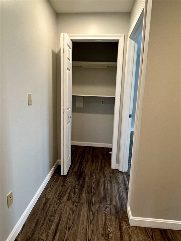 51 Walnut Street, Unit 2 Tiverton, RI 02878 - Photo 13 of 13 a view of walk in closet with wooden floor