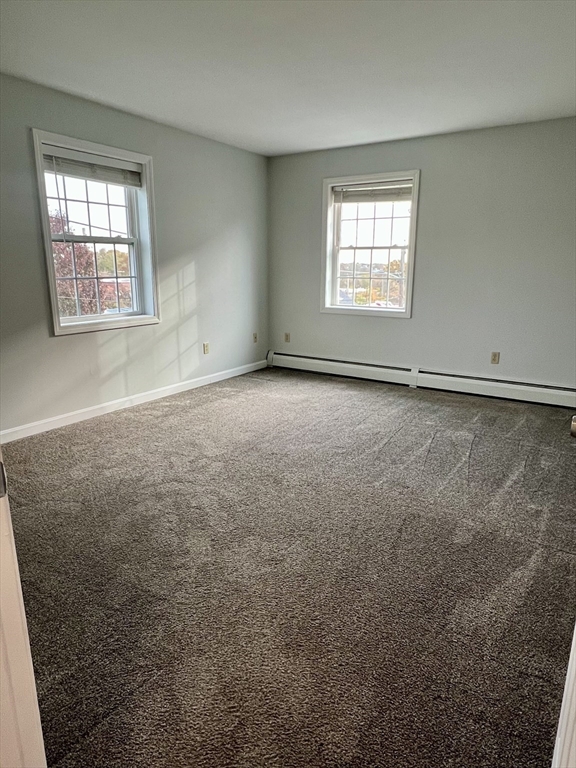 51 Walnut Street, Unit 2 Tiverton, RI 02878 - Photo 4 of 13 an empty room with a window