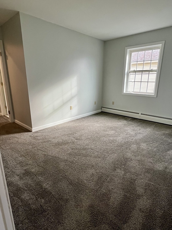 51 Walnut Street, Unit 2 Tiverton, RI 02878 - Photo 10 of 13 an empty room with windows