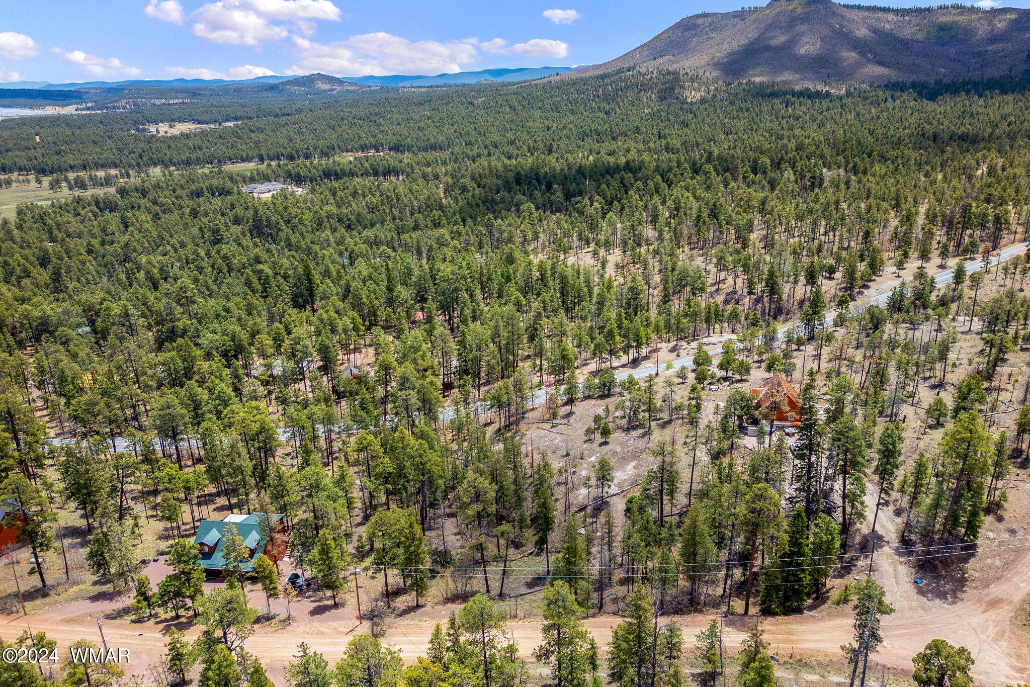 9 2076 Alpine, AZ 85920 - Photo 5 of 15 a view of a city with lush green forest