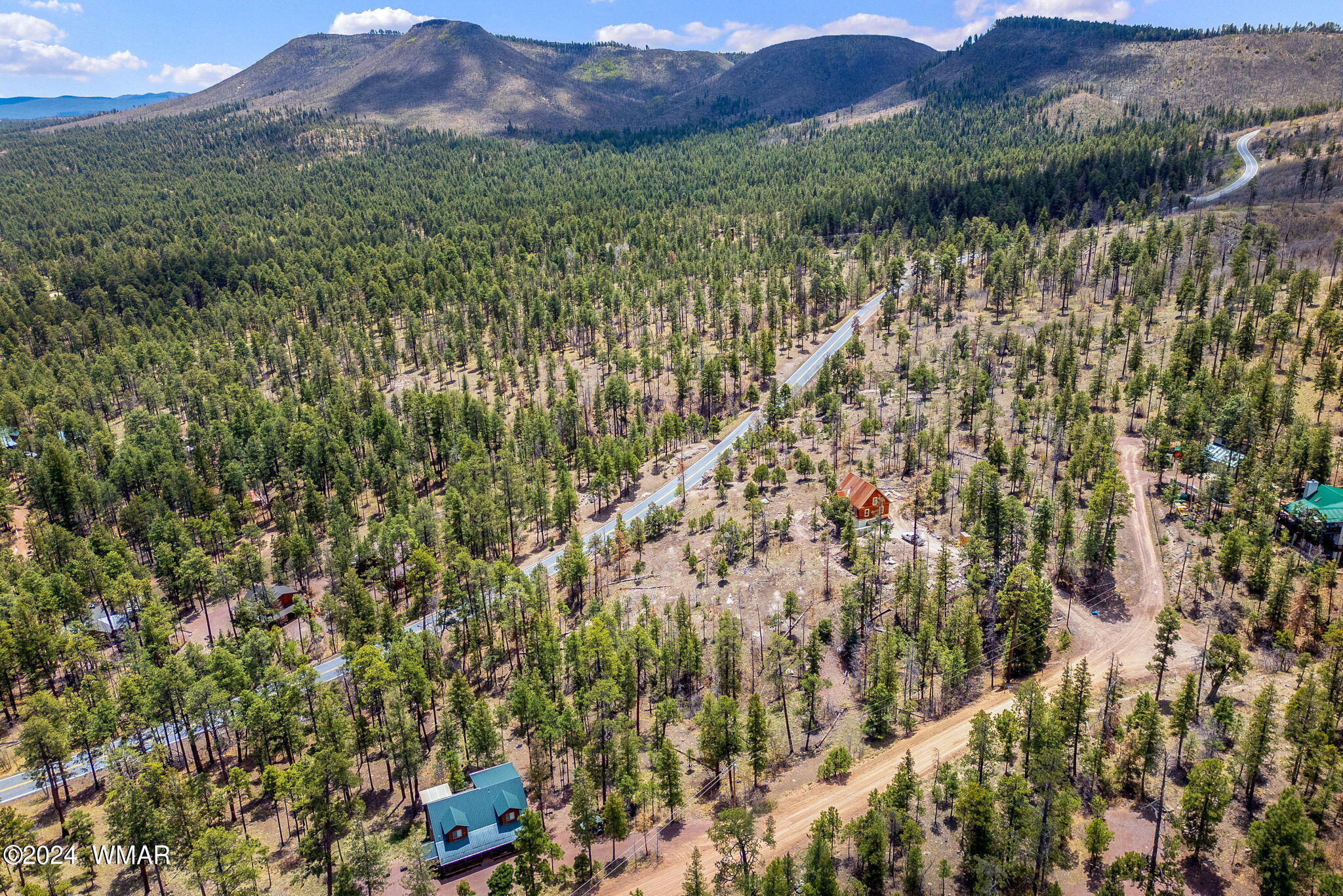 9 2076 Alpine, AZ 85920 - Photo 6 of 15 a view of a lush green hillside and houses