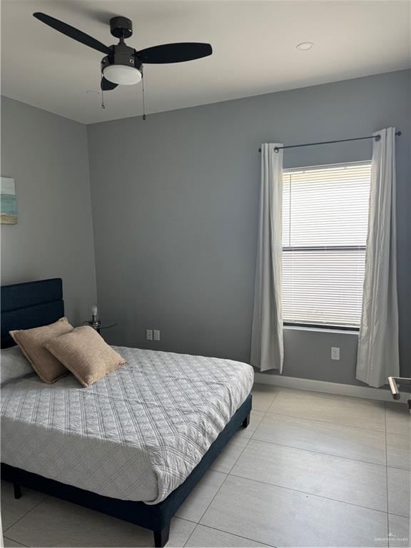 2022 Summerland Lane, Unit 4 Edinburg, TX 78541 - Photo 15 of 31 a bedroom with a bed and window
