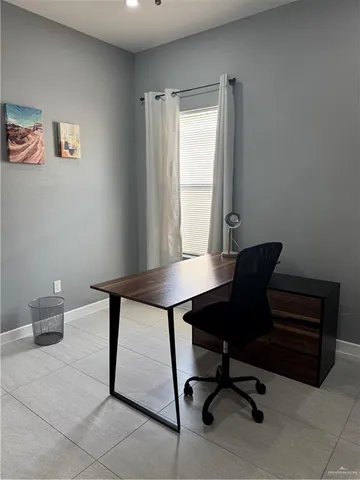 a kitchen with a sink a stove and cabinets