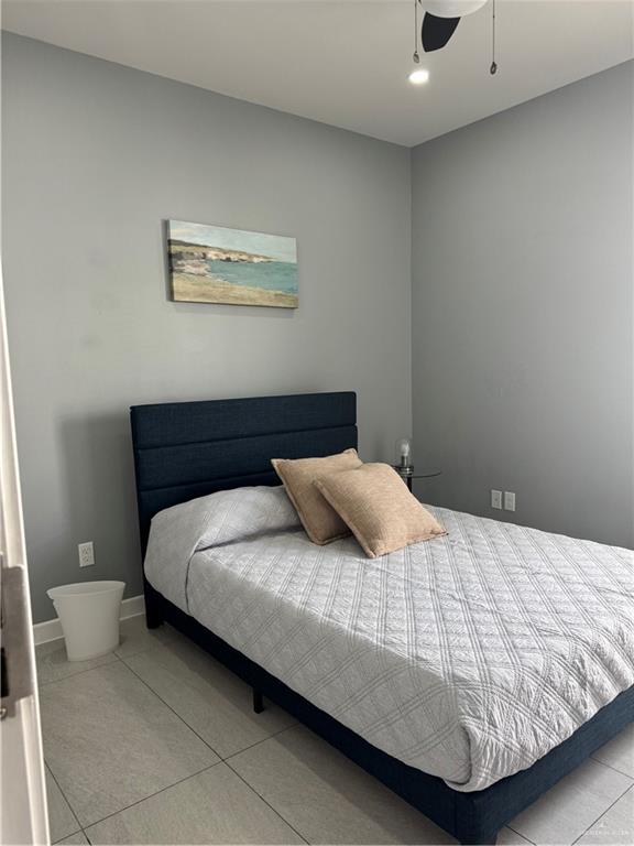 2022 Summerland Lane, Unit 4 Edinburg, TX 78541 - Photo 24 of 31 a bedroom with a bed and painting on the wall