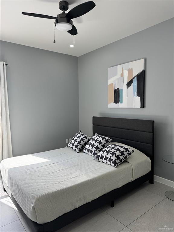 2022 Summerland Lane, Unit 4 Edinburg, TX 78541 - Photo 29 of 31 a bedroom with a bed and window