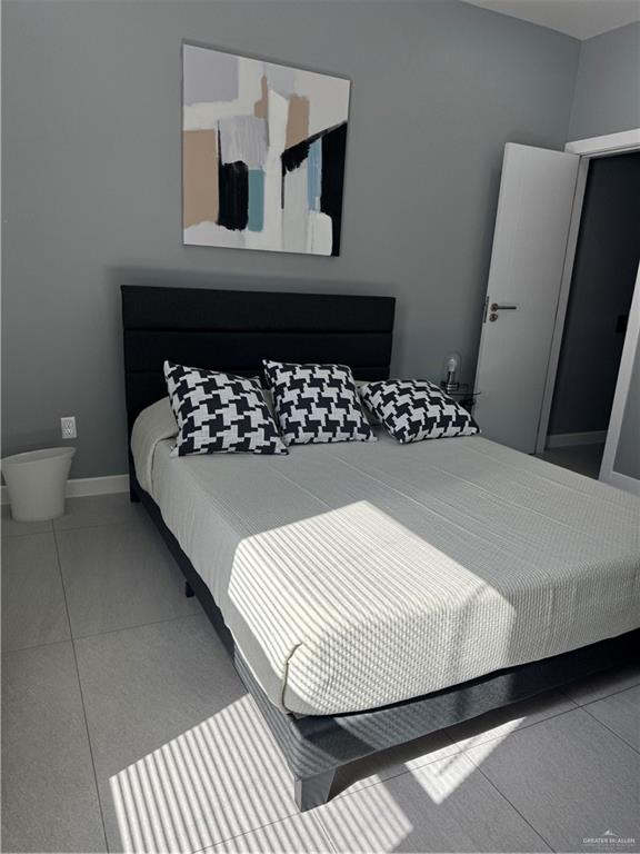 2022 Summerland Lane, Unit 4 Edinburg, TX 78541 - Photo 30 of 31 a bedroom with a bed and window