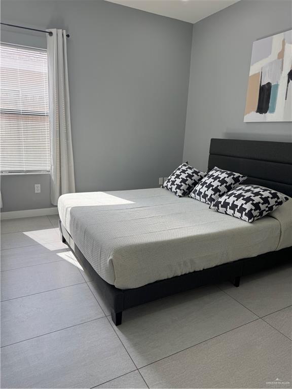 2022 Summerland Lane, Unit 4 Edinburg, TX 78541 - Photo 31 of 31 a bedroom with a bed and window