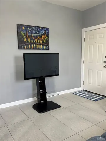 a white toilet sitting next to a bathroom sink and vanity
