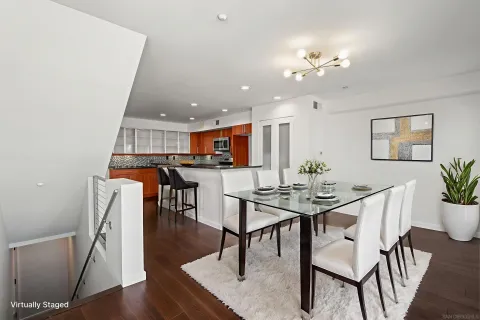 a view of open kitchen with wooden floor and electronic appliances