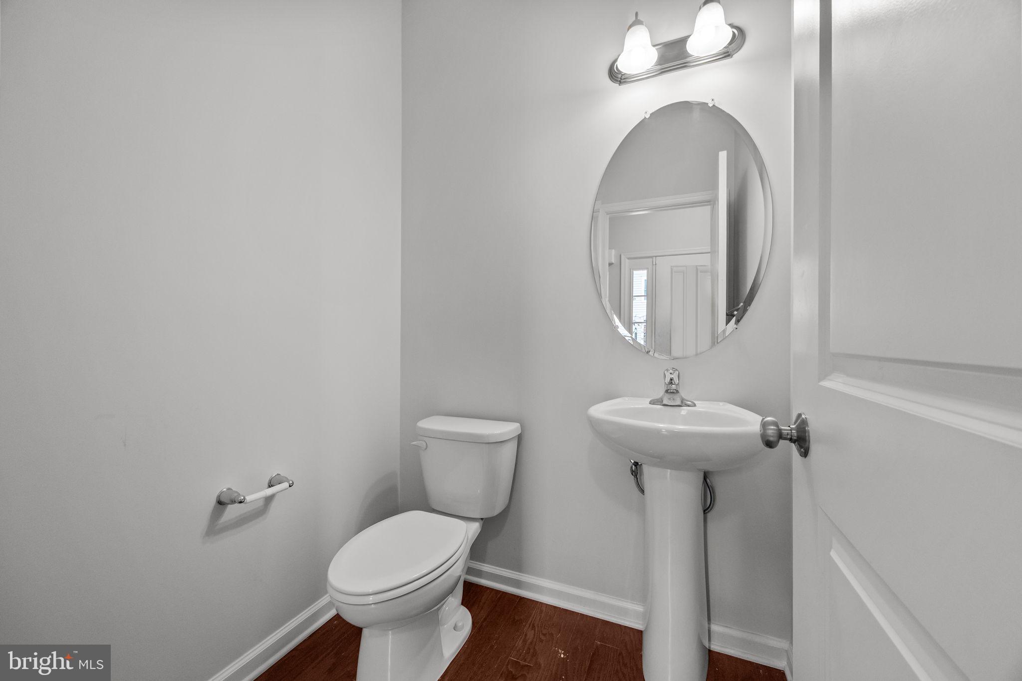 3799 Jacob Stout Road, Unit 2 Doylestown, PA 18902 - Photo 15 of 32 a bathroom with a toilet sink and mirror