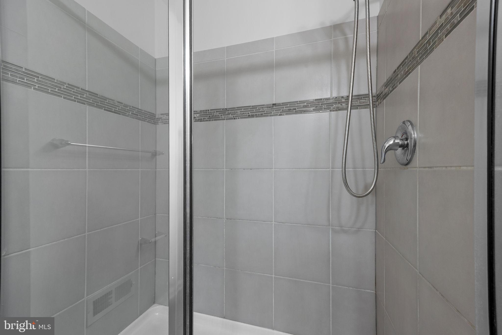 3799 Jacob Stout Road, Unit 2 Doylestown, PA 18902 - Photo 20 of 32 a bathroom with a glass shower door