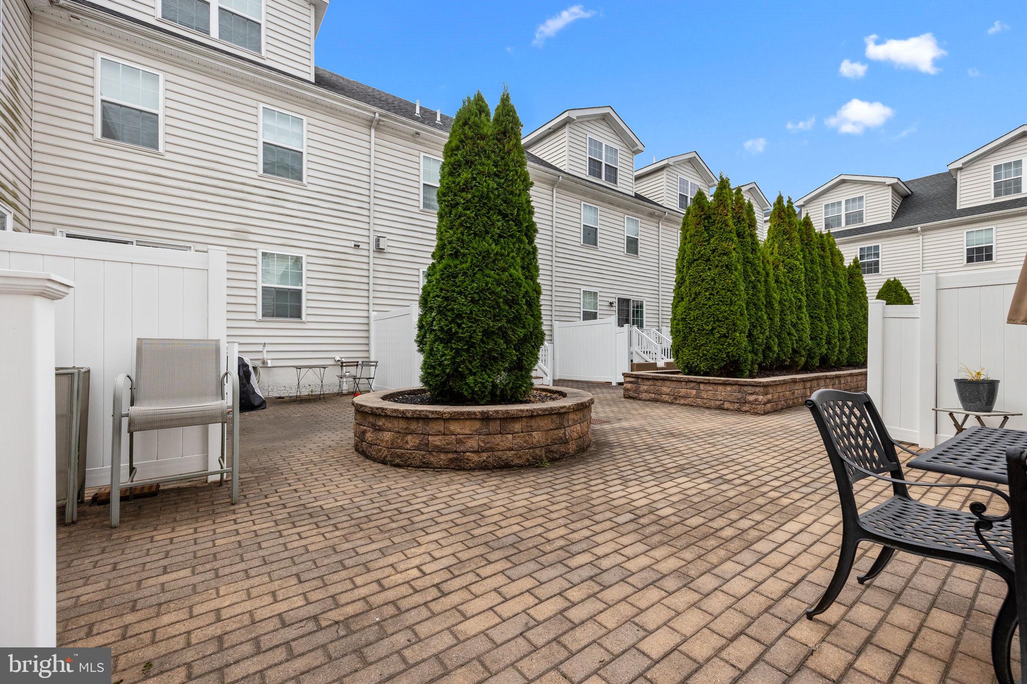 3799 Jacob Stout Road, Unit 2 Doylestown, PA 18902 - Photo 31 of 32 a view of a house with backyard and sitting area