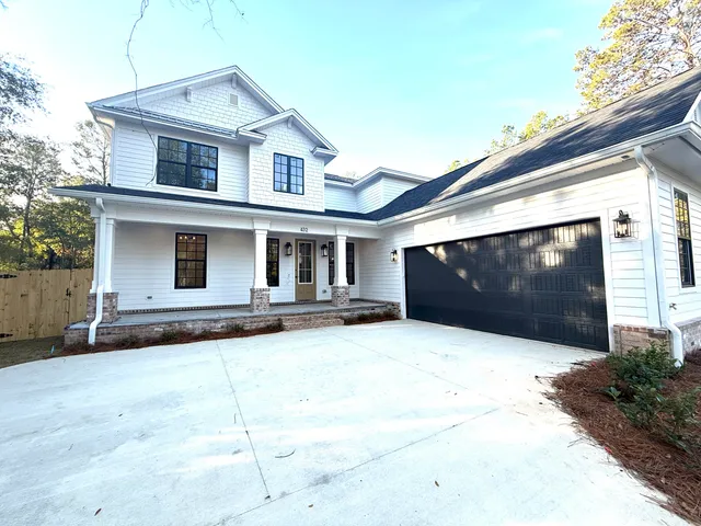 a front view of a house with yard