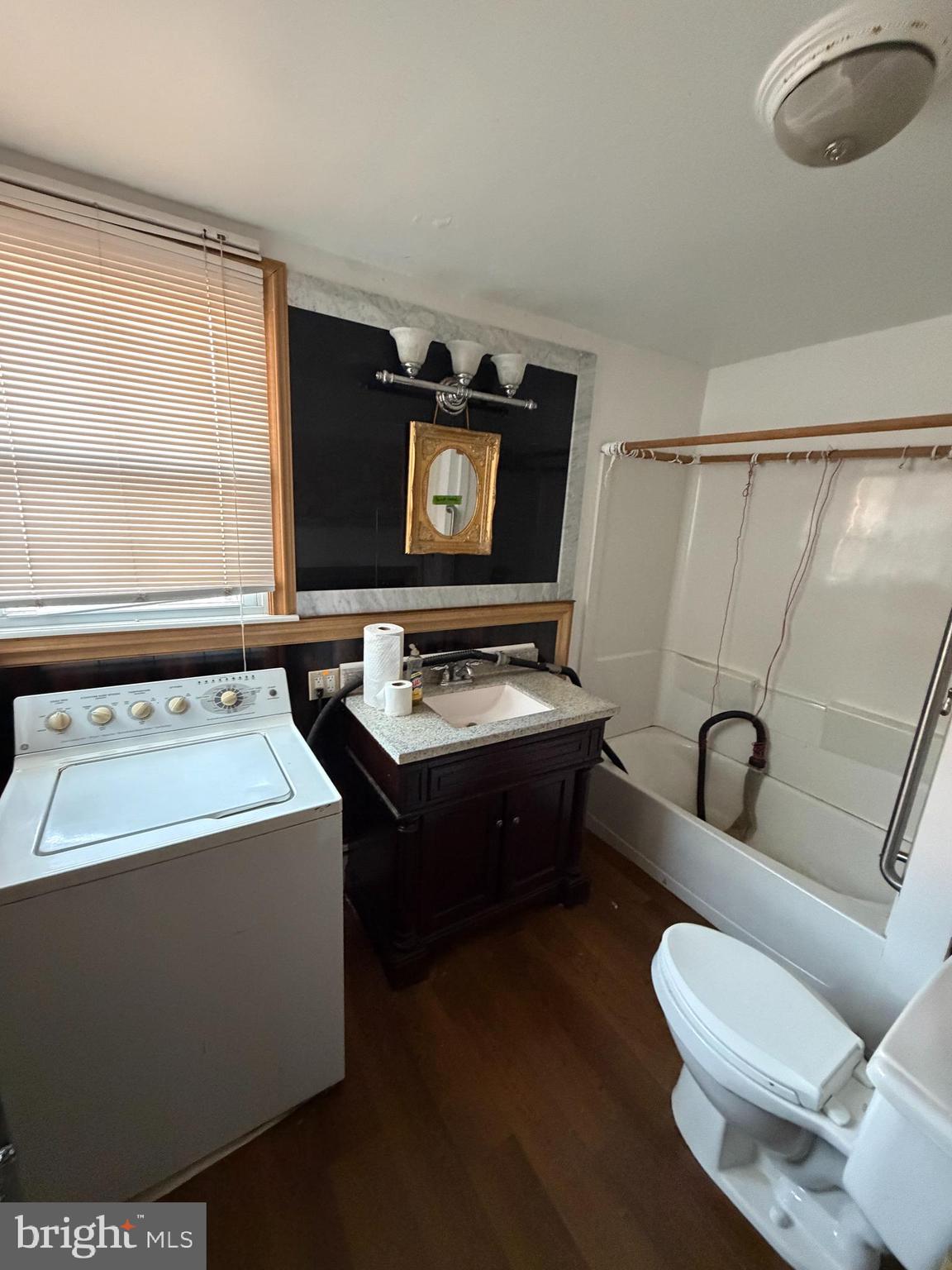 26 Walnut Street Bridgeton, NJ 08302 - Photo 11 of 22 a living room with furniture and a flat screen tv