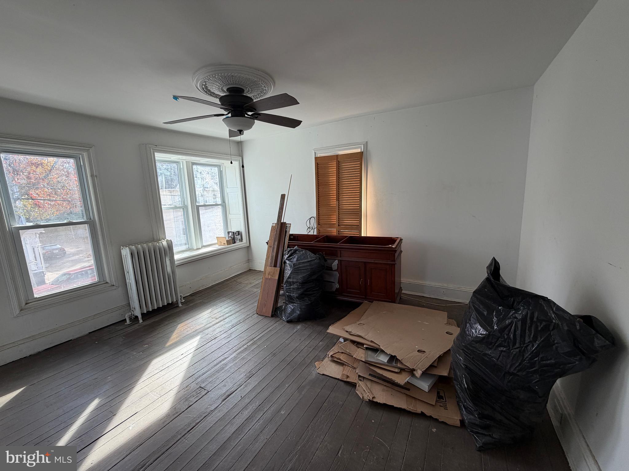 26 Walnut Street Bridgeton, NJ 08302 - Photo 12 of 22 a living room with furniture gym equipment and a window