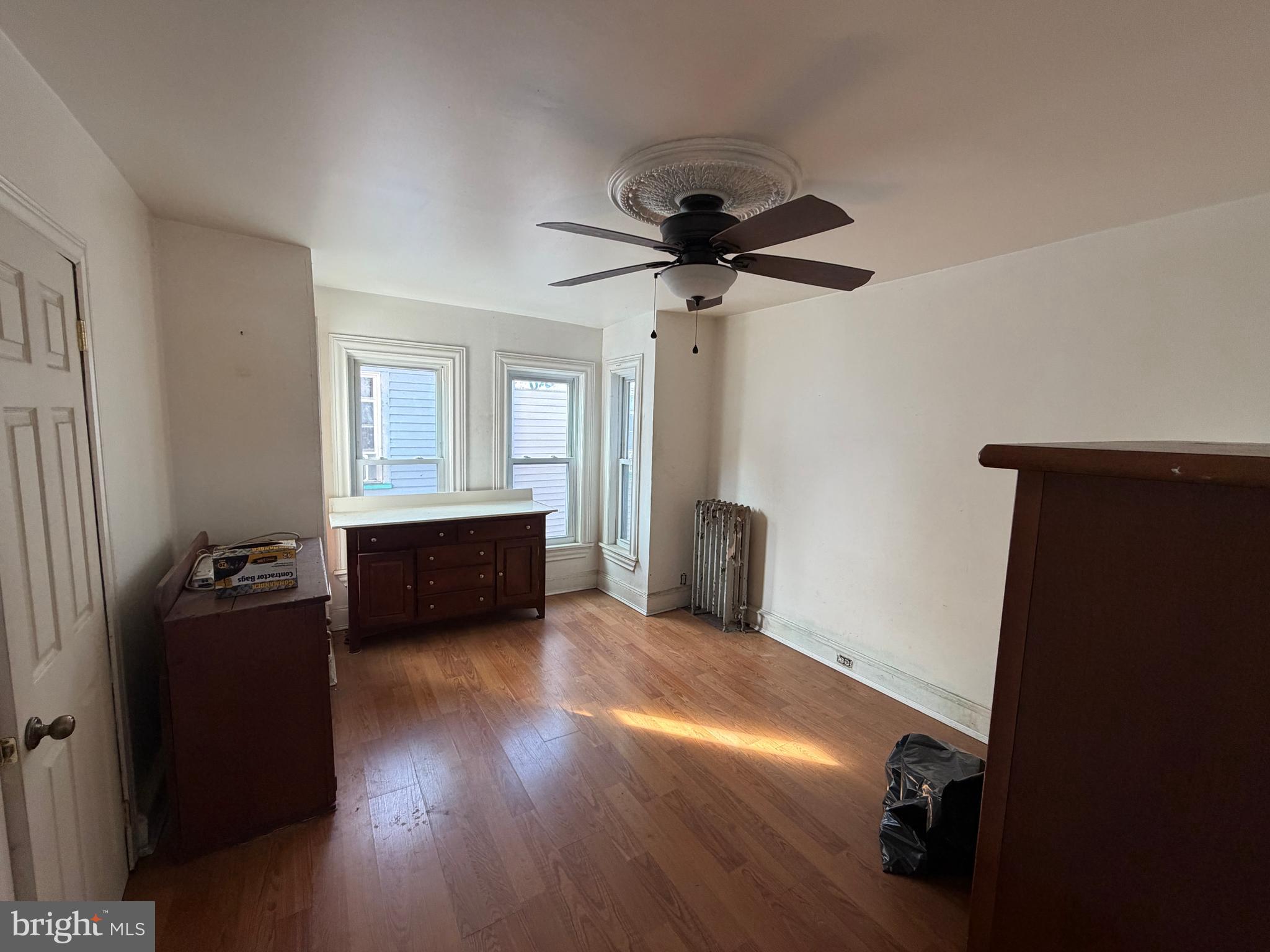 26 Walnut Street Bridgeton, NJ 08302 - Photo 13 of 22 a living room with furniture and a window