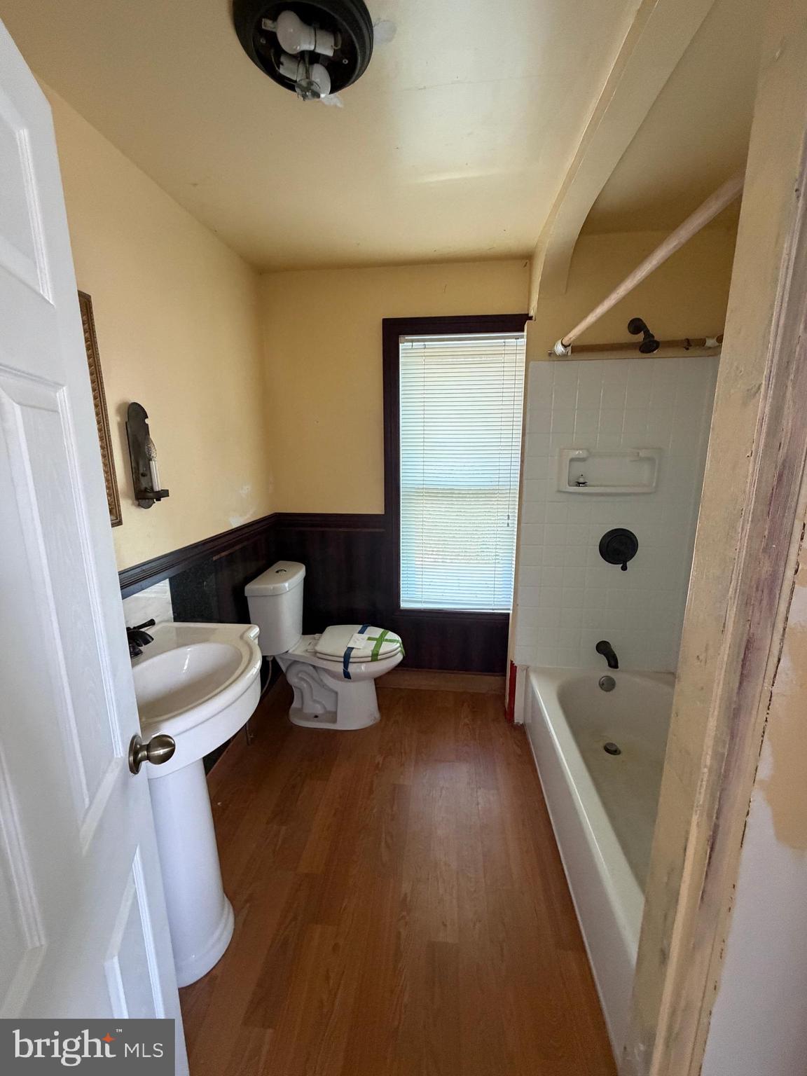 26 Walnut Street Bridgeton, NJ 08302 - Photo 14 of 22 a bathroom with a sink a toilet and shower