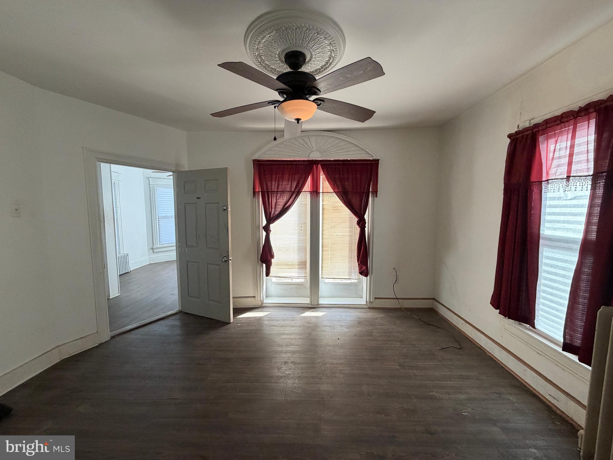 26 Walnut Street Bridgeton, NJ 08302 - Photo 18 of 22 wooden floor in an empty room with a window
