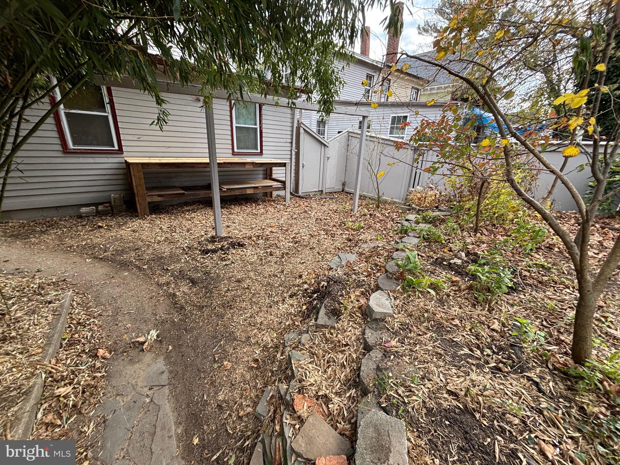 26 Walnut Street Bridgeton, NJ 08302 - Photo 22 of 22 a front view of a house with a garden