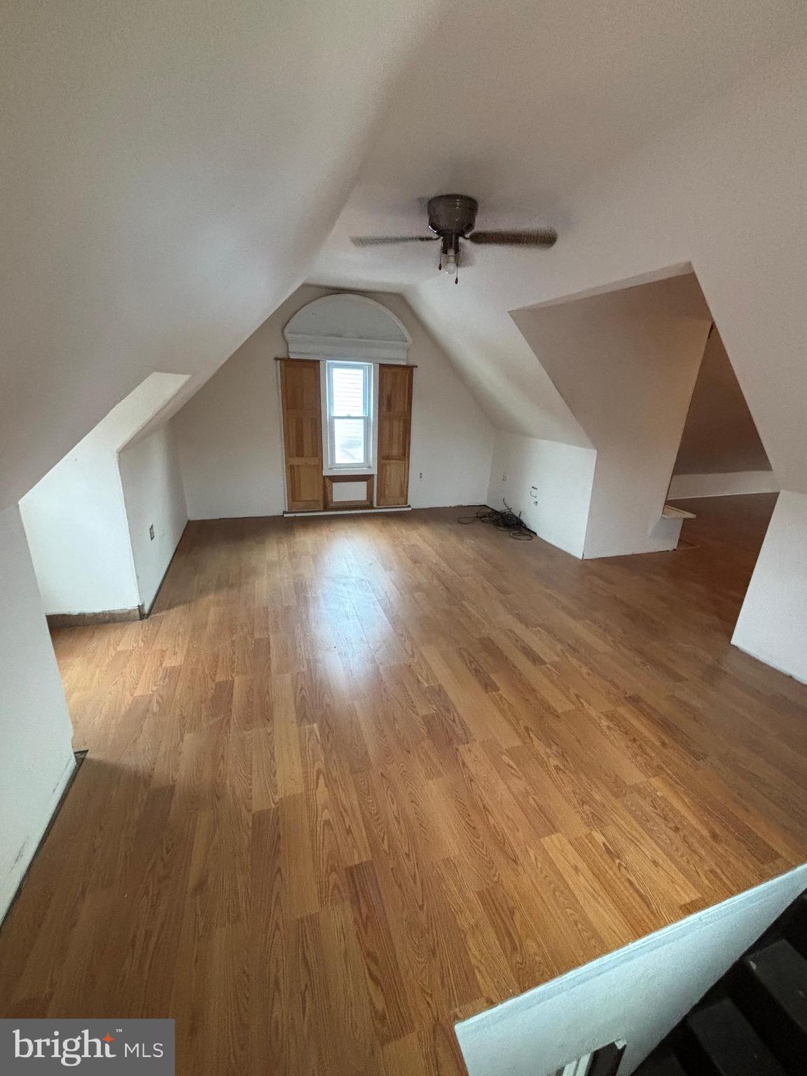 26 Walnut Street Bridgeton, NJ 08302 - Photo 5 of 22 an empty room with wooden floor entryway and windows