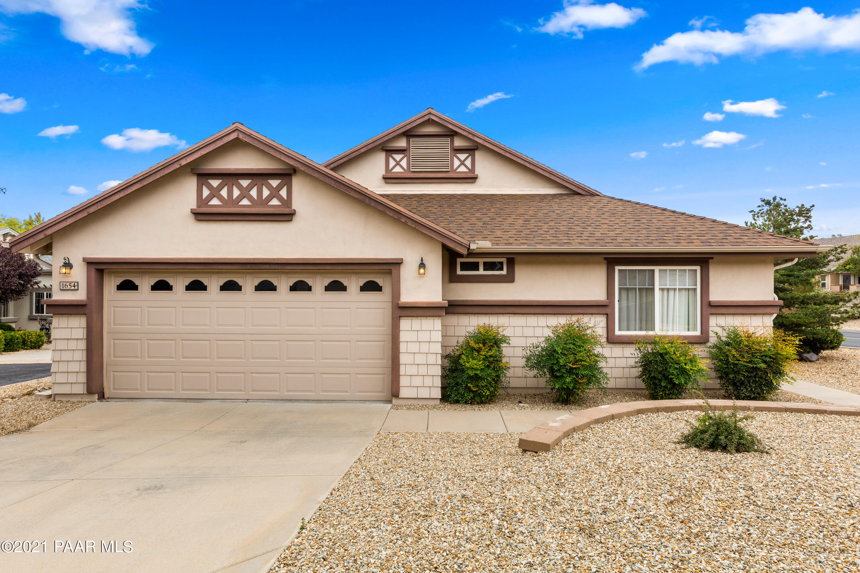 1654 St Andrews Way Prescott, AZ 86301 - Photo 22 of 29 a front view of a house with a yard and garage