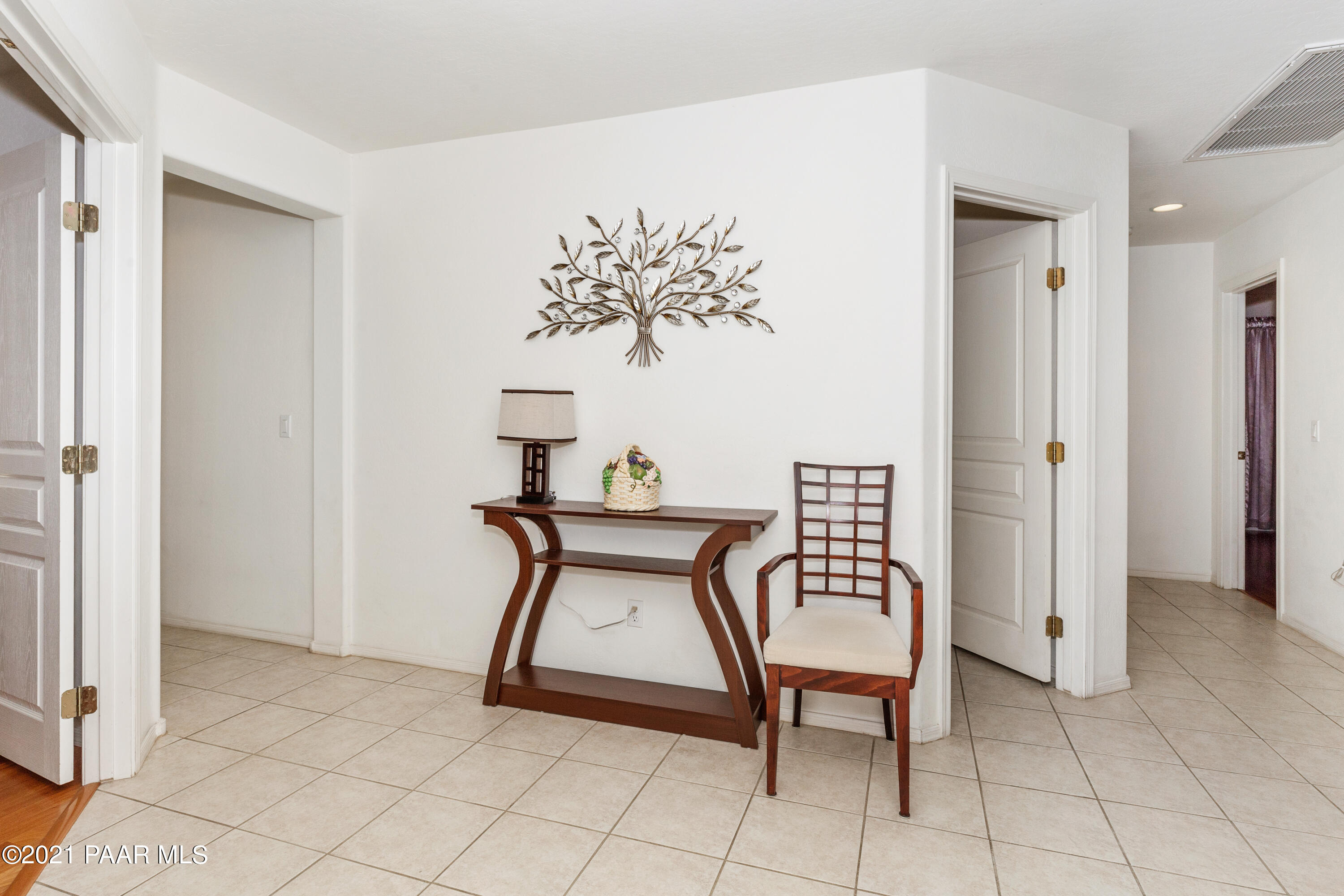1654 St Andrews Way Prescott, AZ 86301 - Photo 4 of 29 a view of a hallway with front door and wooden floor