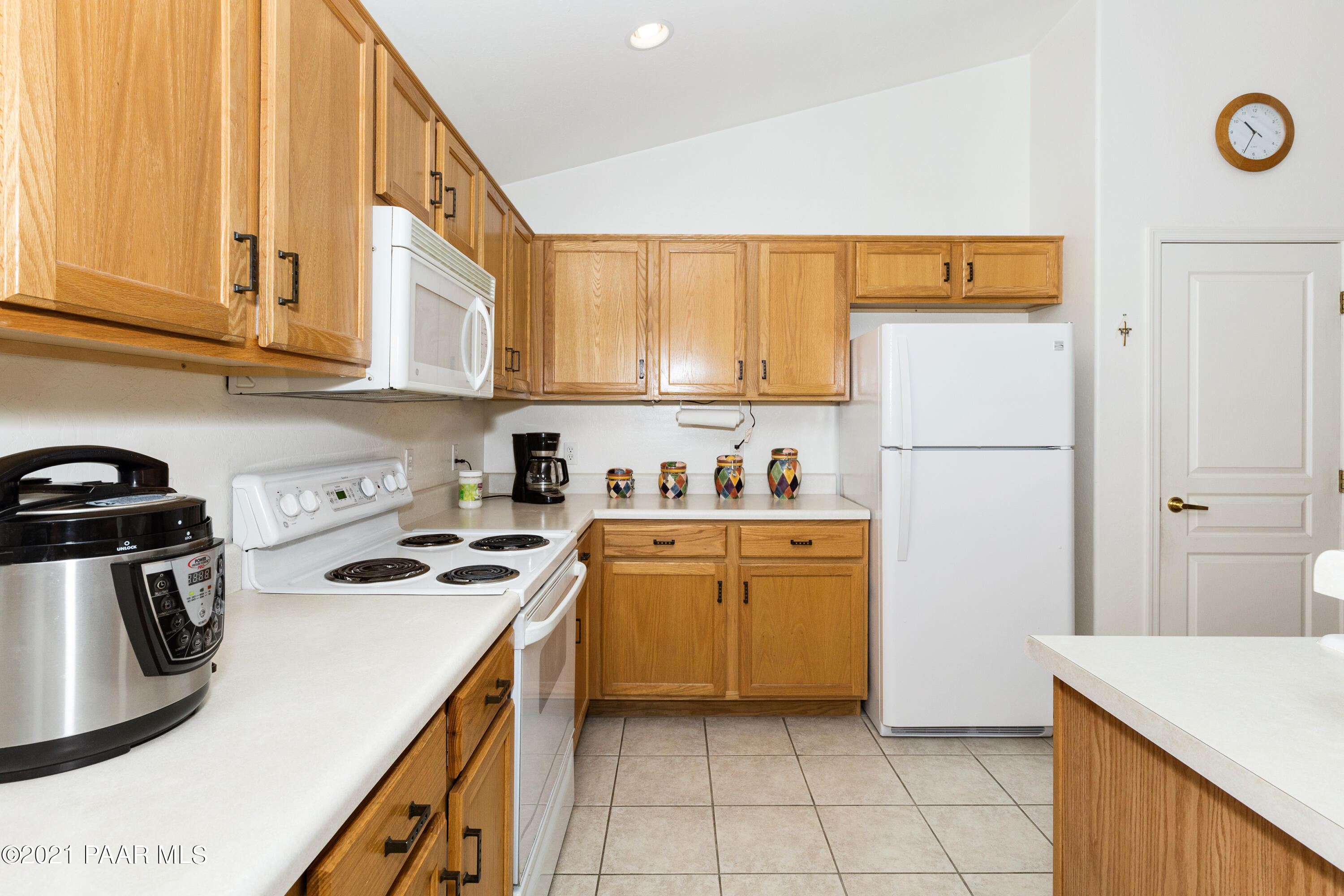 1654 St Andrews Way Prescott, AZ 86301 - Photo 10 of 29 a kitchen with a refrigerator a stove a sink and a cabinets
