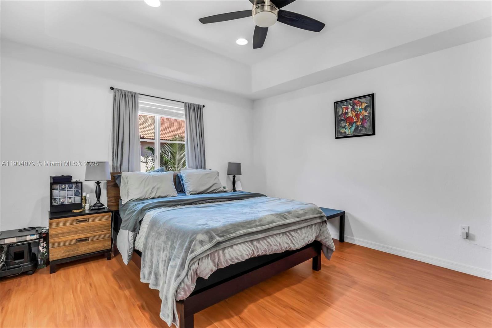 22232 Southwest 88th Path Cutler Bay, FL 33190 - Photo 20 of 72 a bedroom with a bed and a dresser