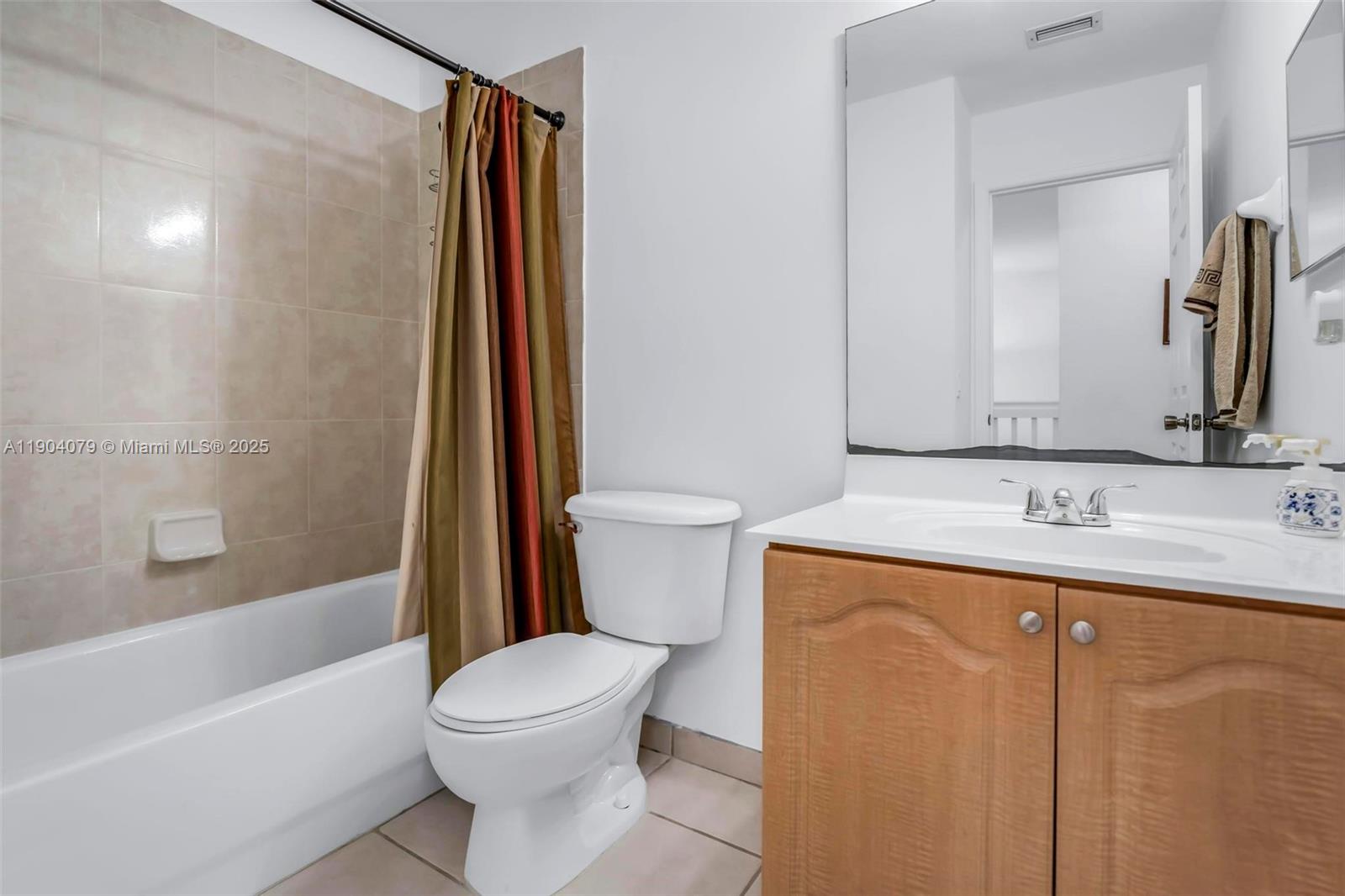 22232 Southwest 88th Path Cutler Bay, FL 33190 - Photo 26 of 72 a bathroom with a sink a toilet and shower