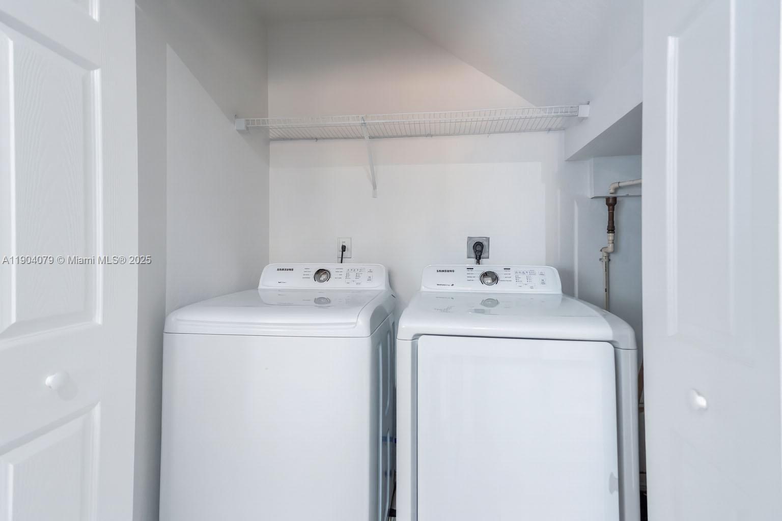 22232 Southwest 88th Path Cutler Bay, FL 33190 - Photo 30 of 72 a utility room with dryer and washer