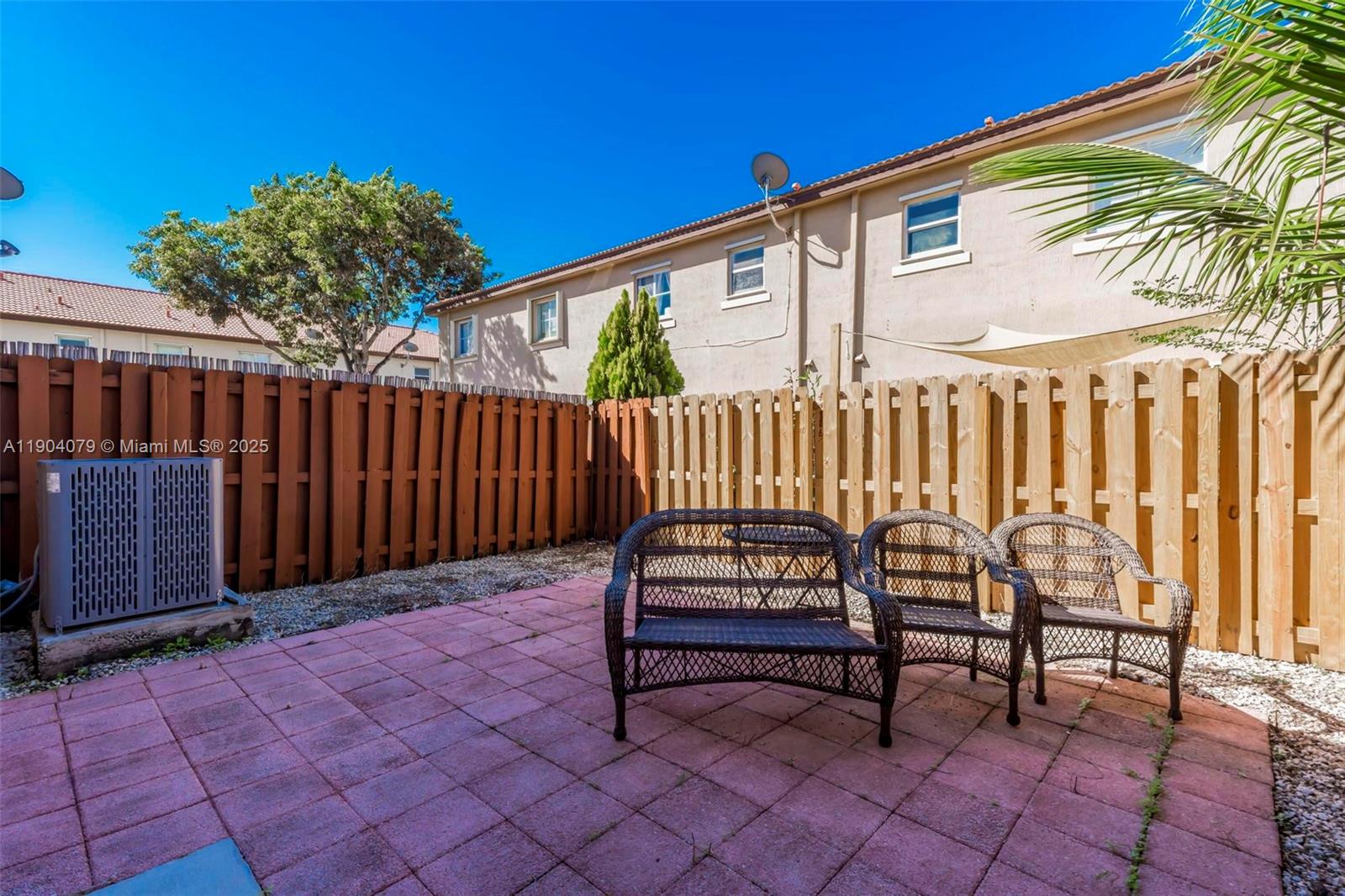 22232 Southwest 88th Path Cutler Bay, FL 33190 - Photo 33 of 72 a backyard of a house with barbeque oven table and chairs