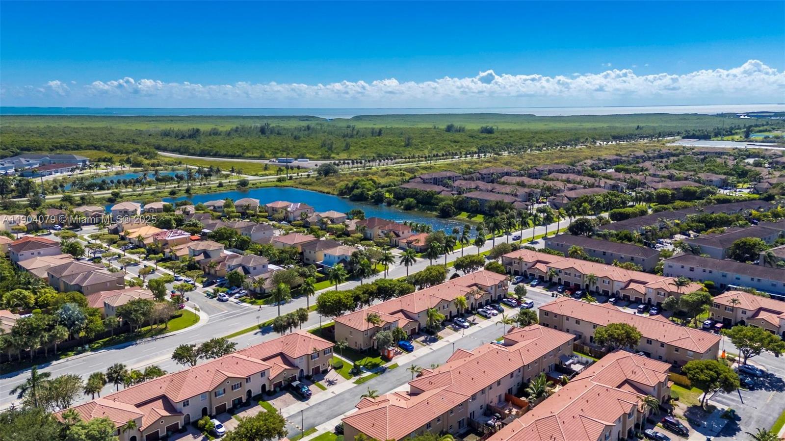22232 Southwest 88th Path Cutler Bay, FL 33190 - Photo 40 of 72 an aerial view of residential building with outdoor space