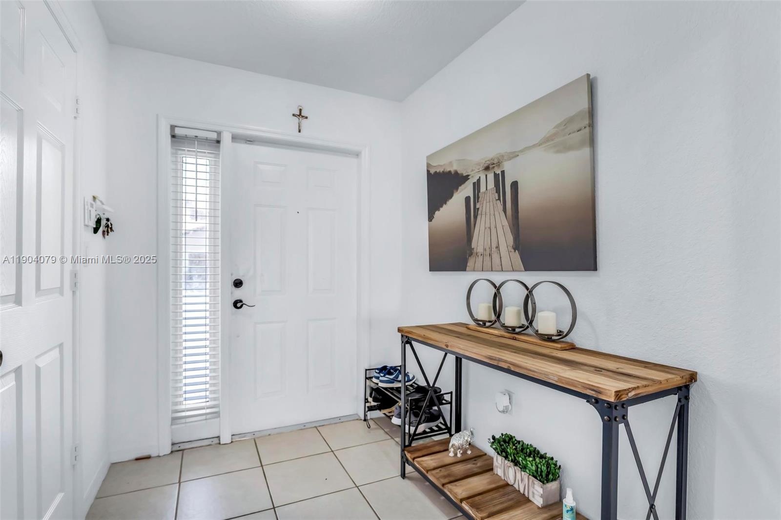 22232 Southwest 88th Path Cutler Bay, FL 33190 - Photo 4 of 72 a bathroom with a sink a mirror and vanity