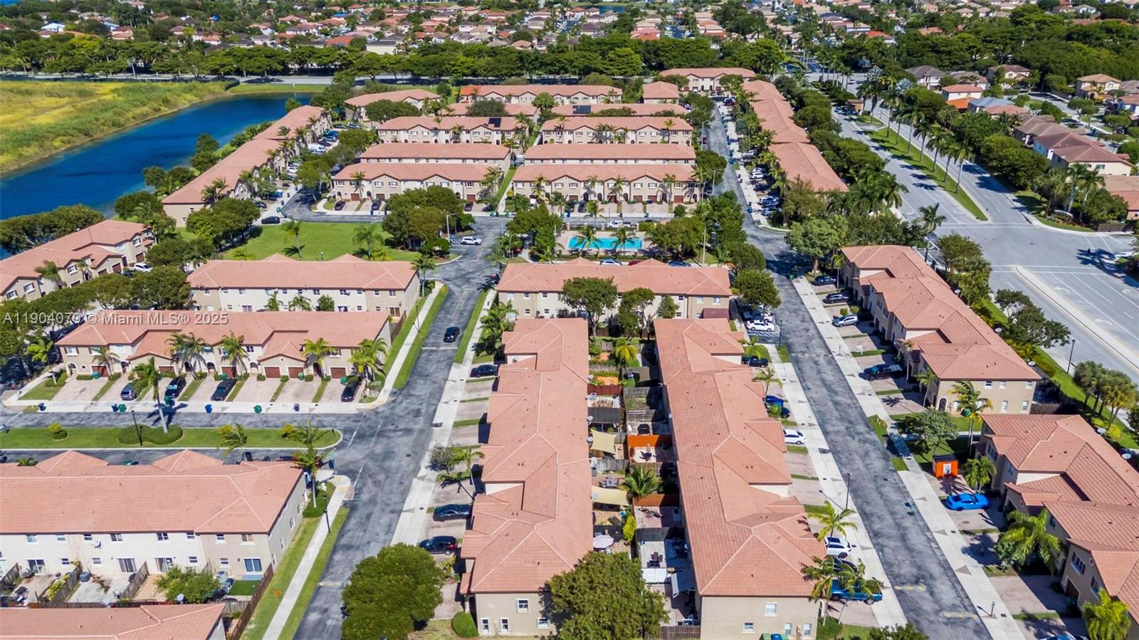 22232 Southwest 88th Path Cutler Bay, FL 33190 - Photo 44 of 72 an aerial view of a city with lots of residential buildings ocean and mountain view in back