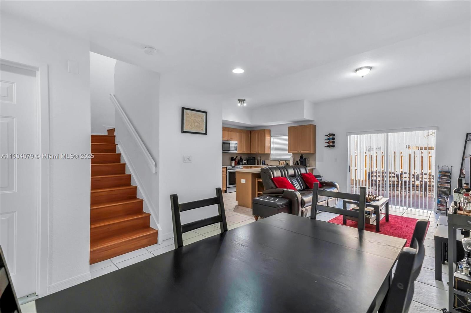 22232 Southwest 88th Path Cutler Bay, FL 33190 - Photo 5 of 72 a view of a living room with furniture and a wooden floor