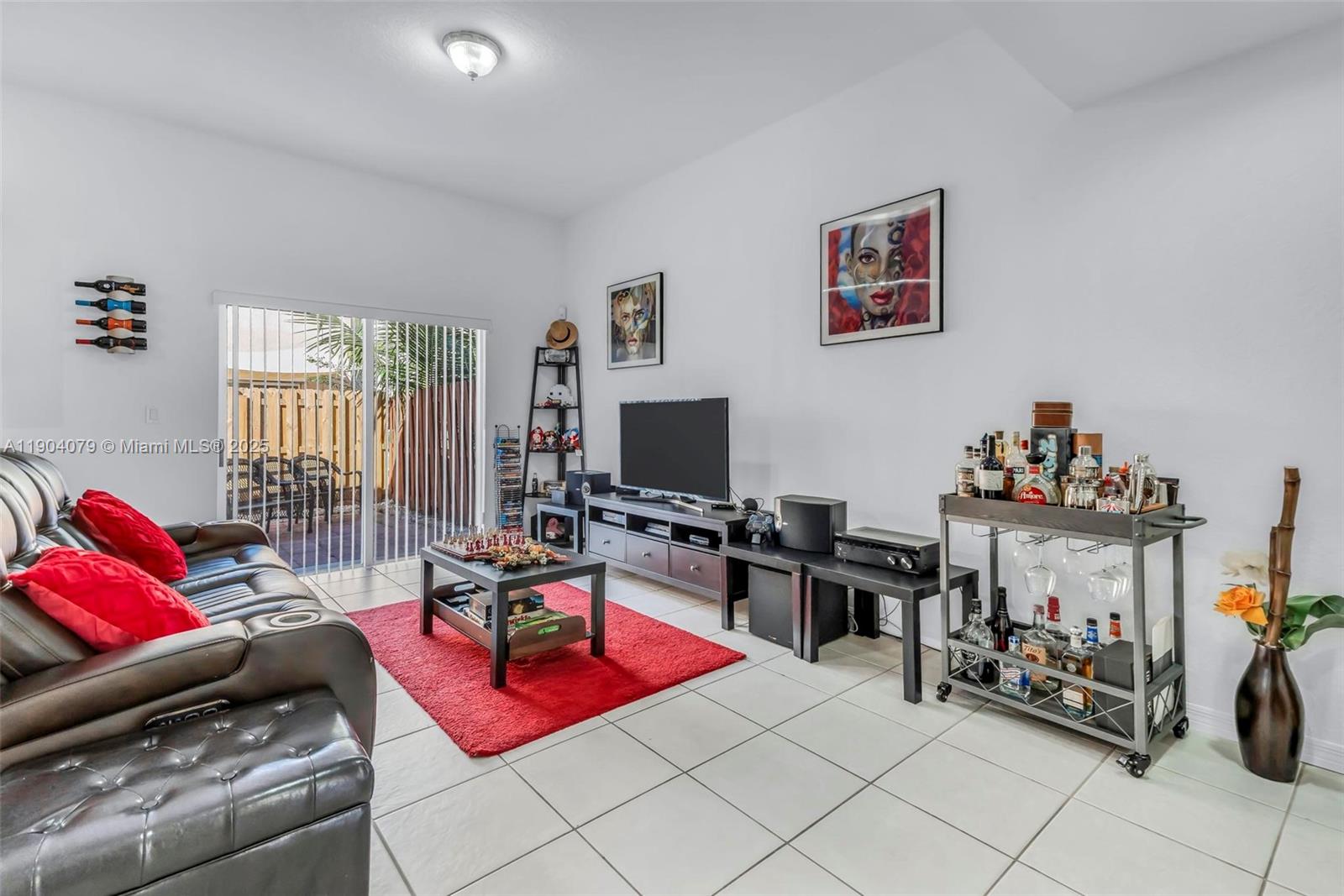 22232 Southwest 88th Path Cutler Bay, FL 33190 - Photo 6 of 72 a living room with furniture and a flat screen tv