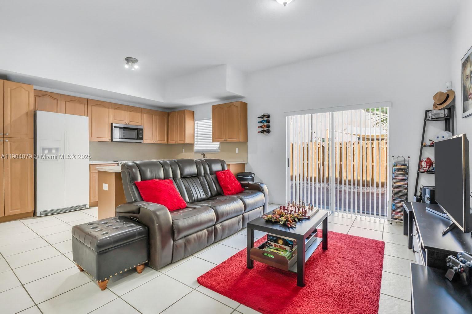22232 Southwest 88th Path Cutler Bay, FL 33190 - Photo 8 of 72 a living room with furniture and a flat screen tv