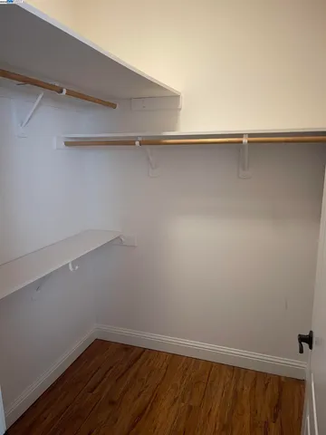 a view of an empty walk in closet