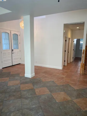 a view of a hallway with staircase