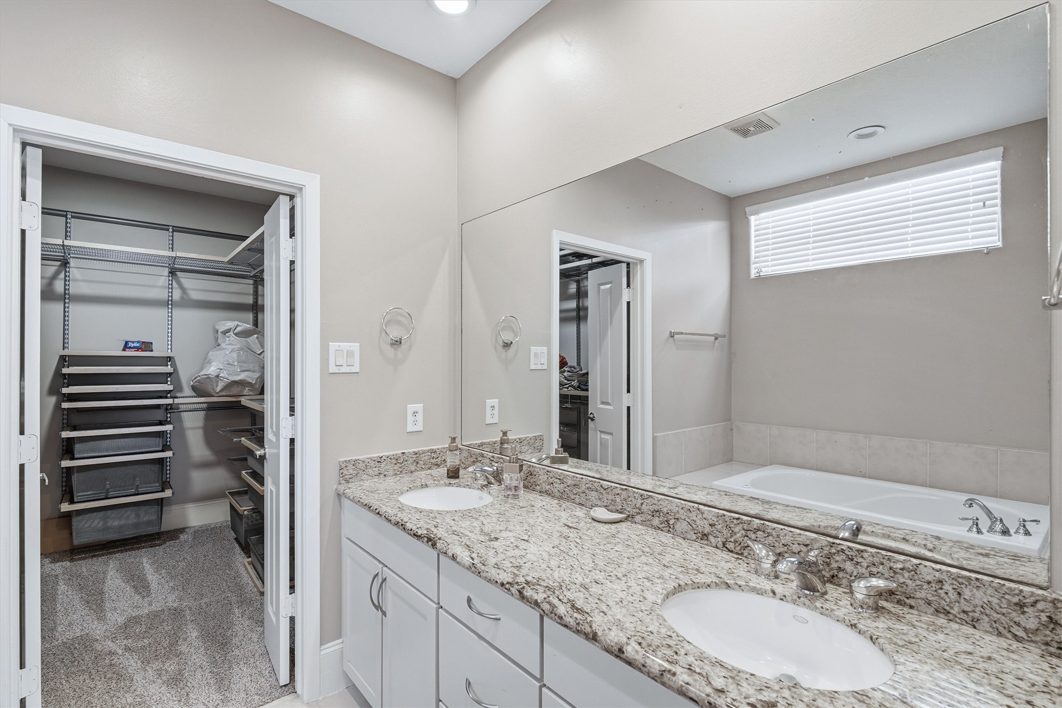 2529 Rusk Street Houston, TX 77003 - Photo 15 of 23 Primary bathroom with dual sinks and granite countertop