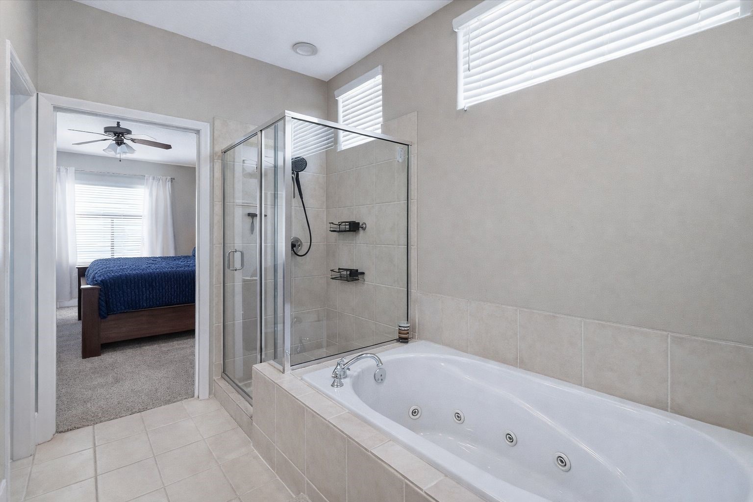 2529 Rusk Street Houston, TX 77003 - Photo 16 of 23 Primary bathroom featuring jetted, soaking tub and separate glass shower