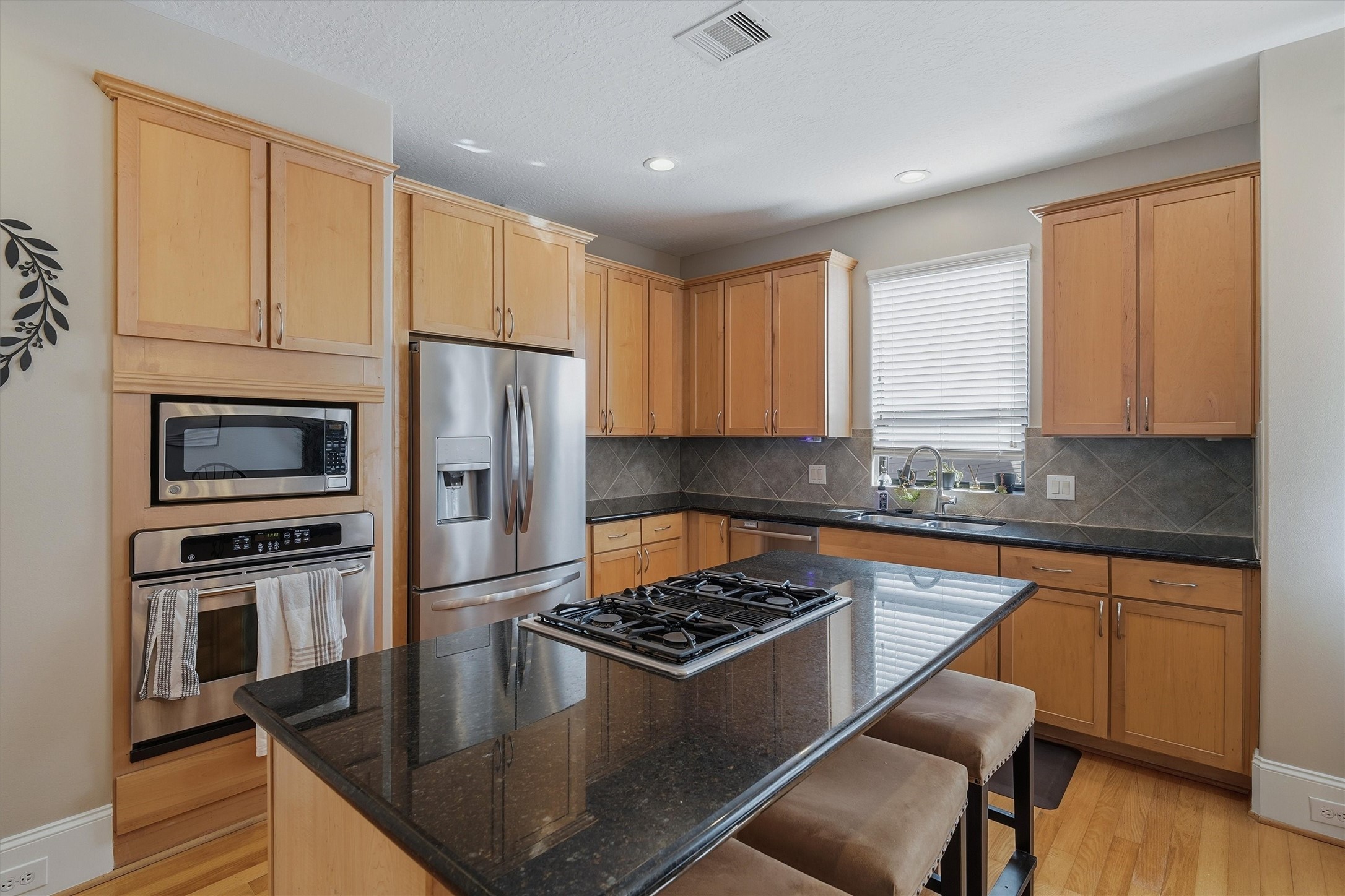2529 Rusk Street Houston, TX 77003 - Photo 8 of 23 Kitchen with granite countertops, island, and stainless appliances