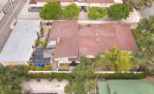 an aerial view of house with yard swimming pool and outdoor seating