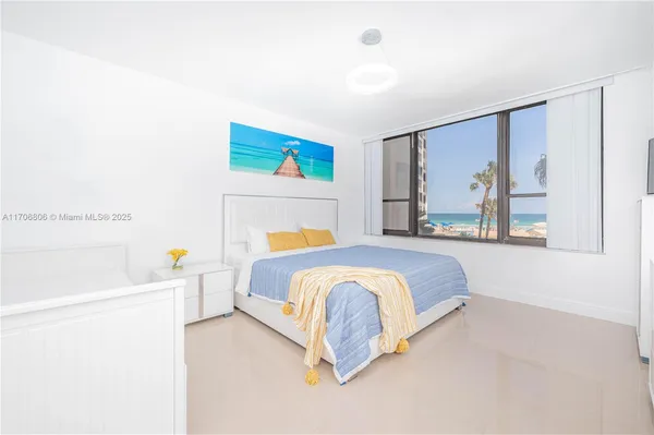 a bedroom with a bed and a cabinets
