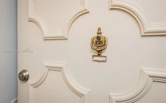 a front view of a residential apartment building with a yard