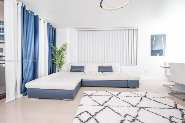 a view of an empty room with a window and storage