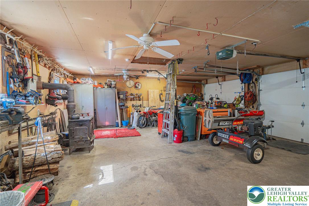 341 Lower Greenhill Road Kunkletown, PA 18058 - Photo 42 of 69 Functional garage with ample space for tools and storage, ready for any project.
