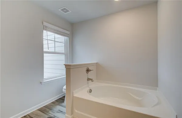 a bathroom with a shower sink and mirror