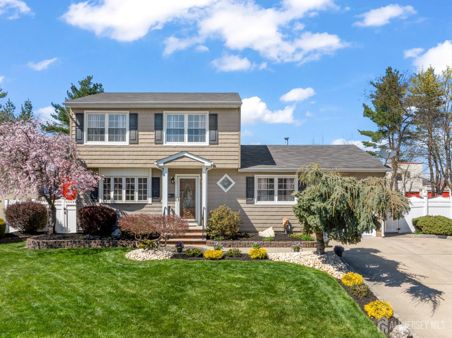 6 Marie Lane Edison, NJ 08817 - Photo 1 of 35 a front view of house with yard and trees around