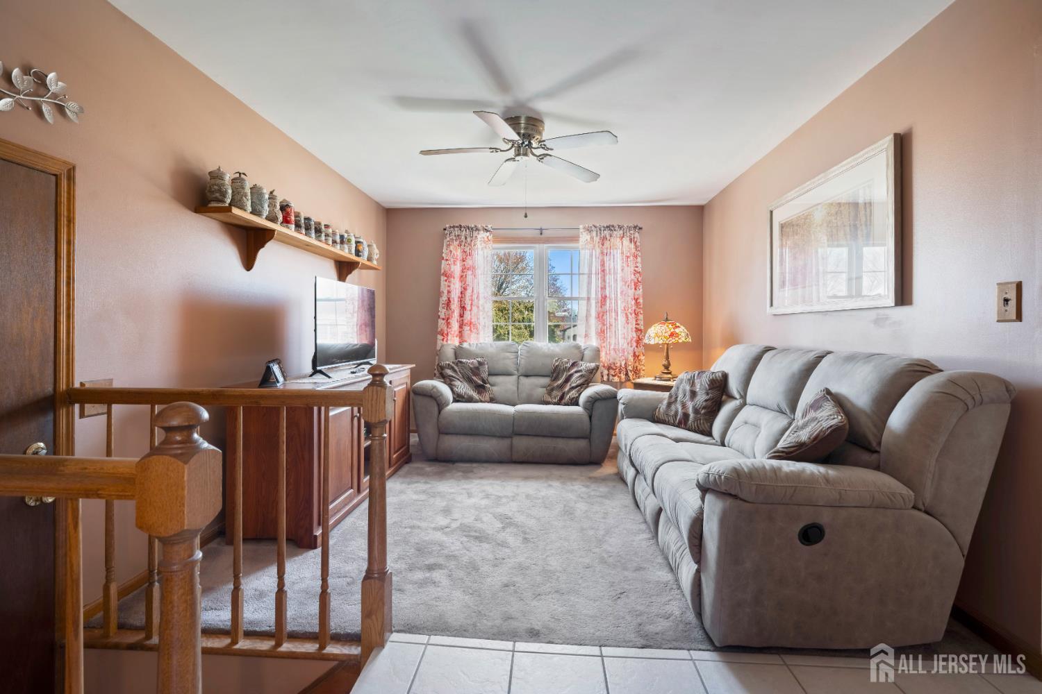 6 Marie Lane Edison, NJ 08817 - Photo 14 of 35 a living room with furniture ceiling fan and a window
